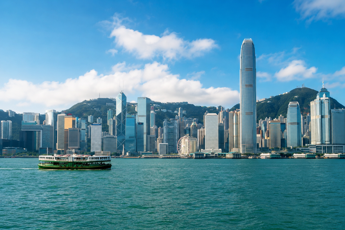 Ferry crossing Hong Kong Victoria Harbour beneath the skyline