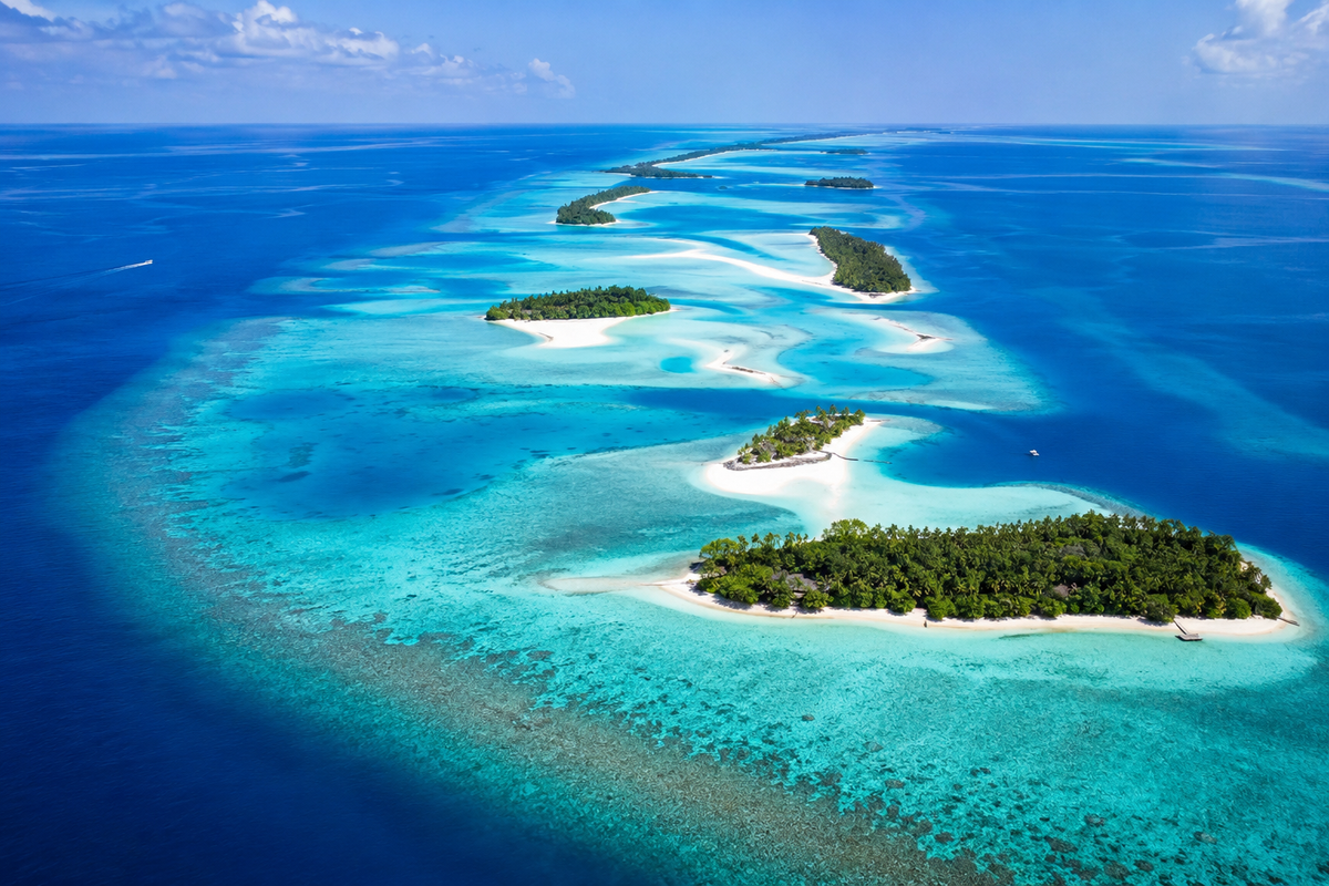 Aerial view of small Maldives islands, sandbanks and reef channels