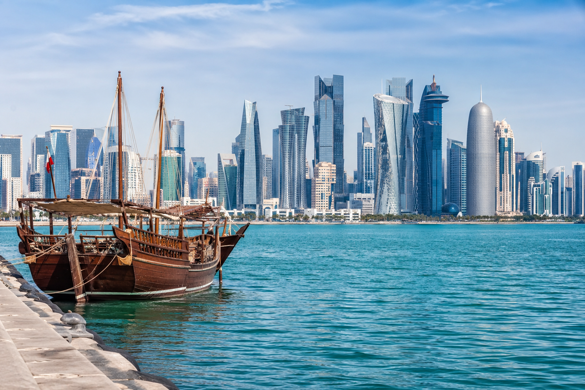 Traditional dhow and Doha West Bay skyline viewed from the Corniche